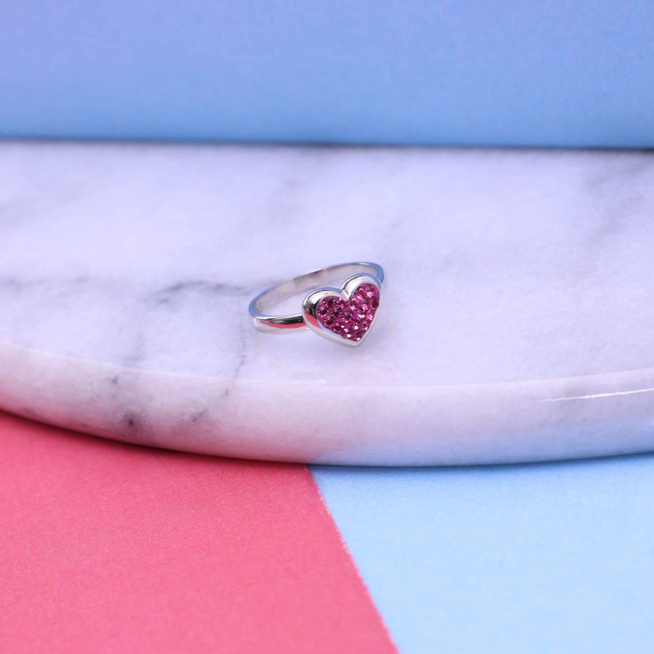 Zilveren goldplated kinderring met roze kristal