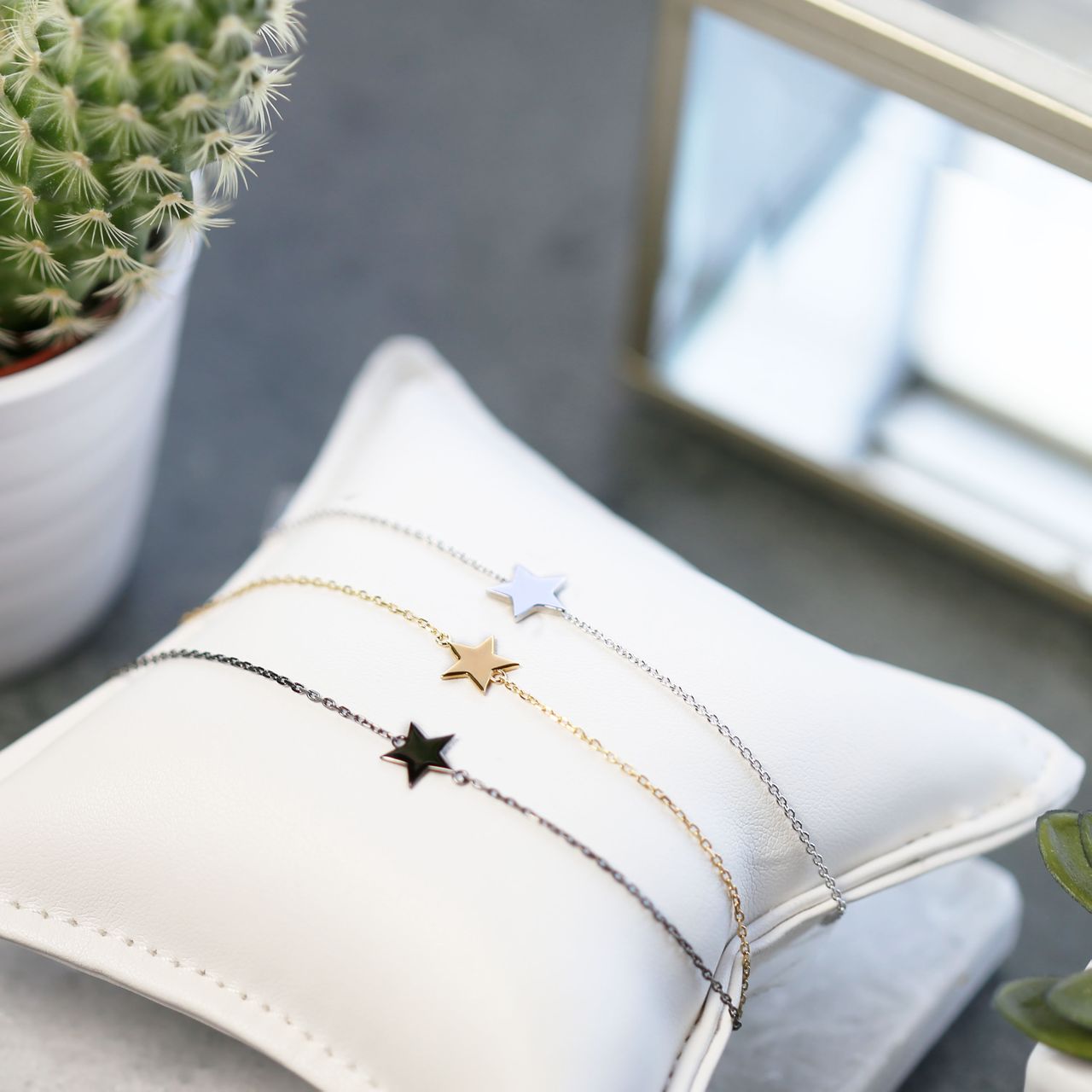 Zilveren goldplated schakelarmband met ster voor dames