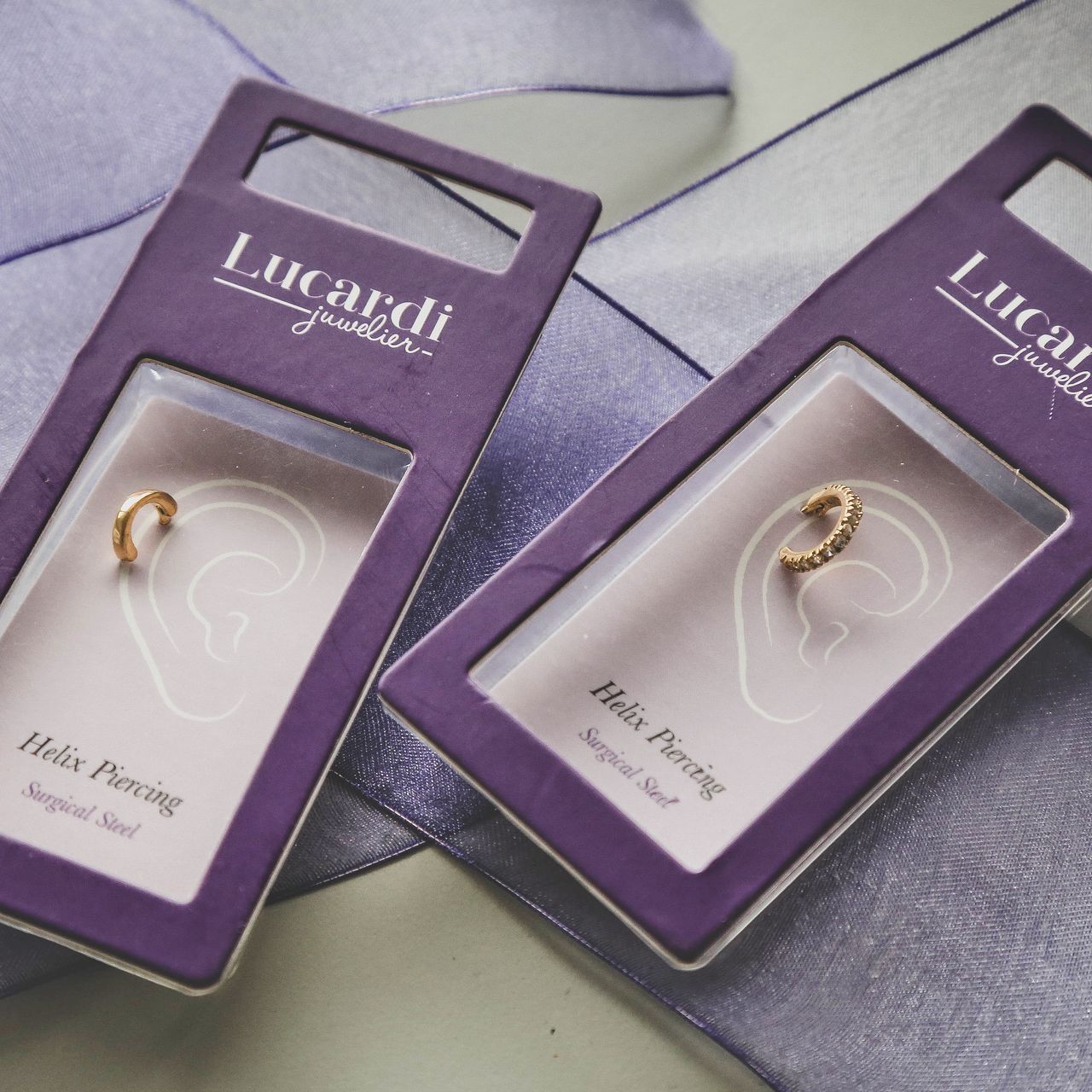 Stainless steel goldplated helixpiercing met zirkonia