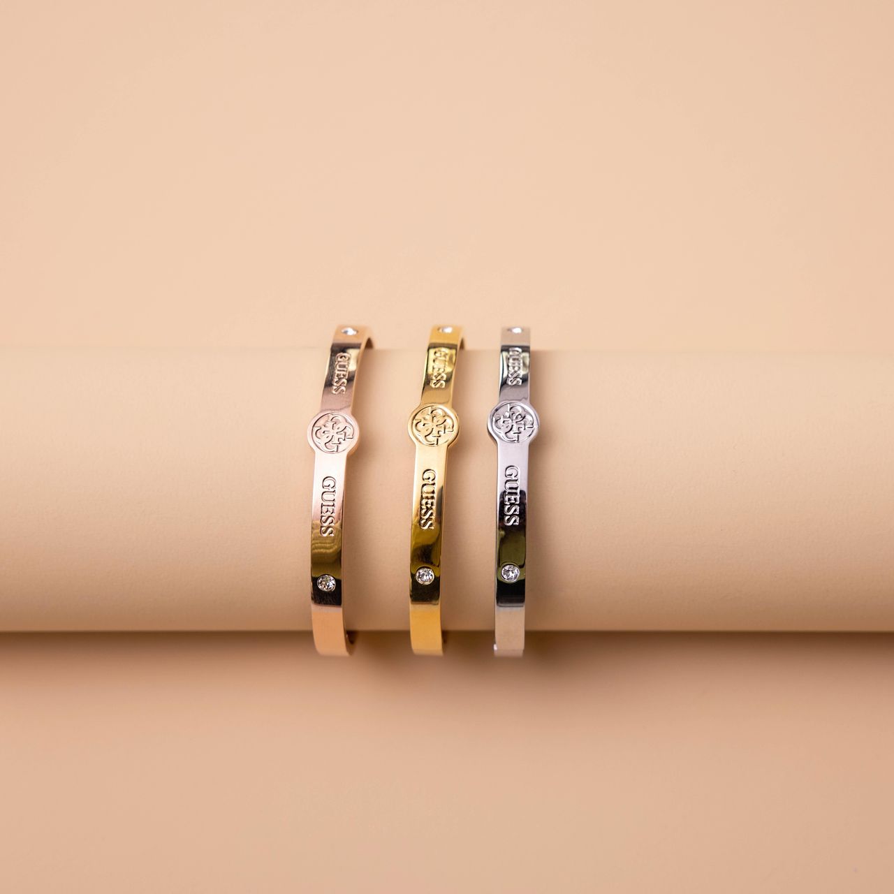 Guess-Armreif, Edelstahl, rotvergoldet, 4G-Logo