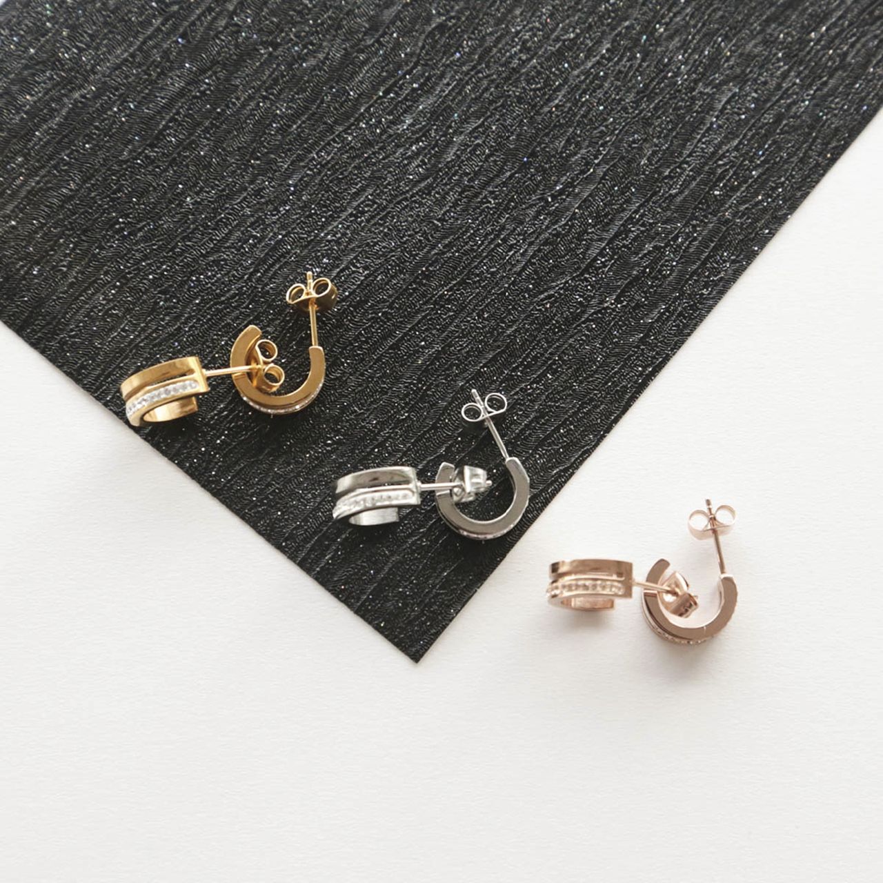 Stalen oorbellen roseplated wit kristal