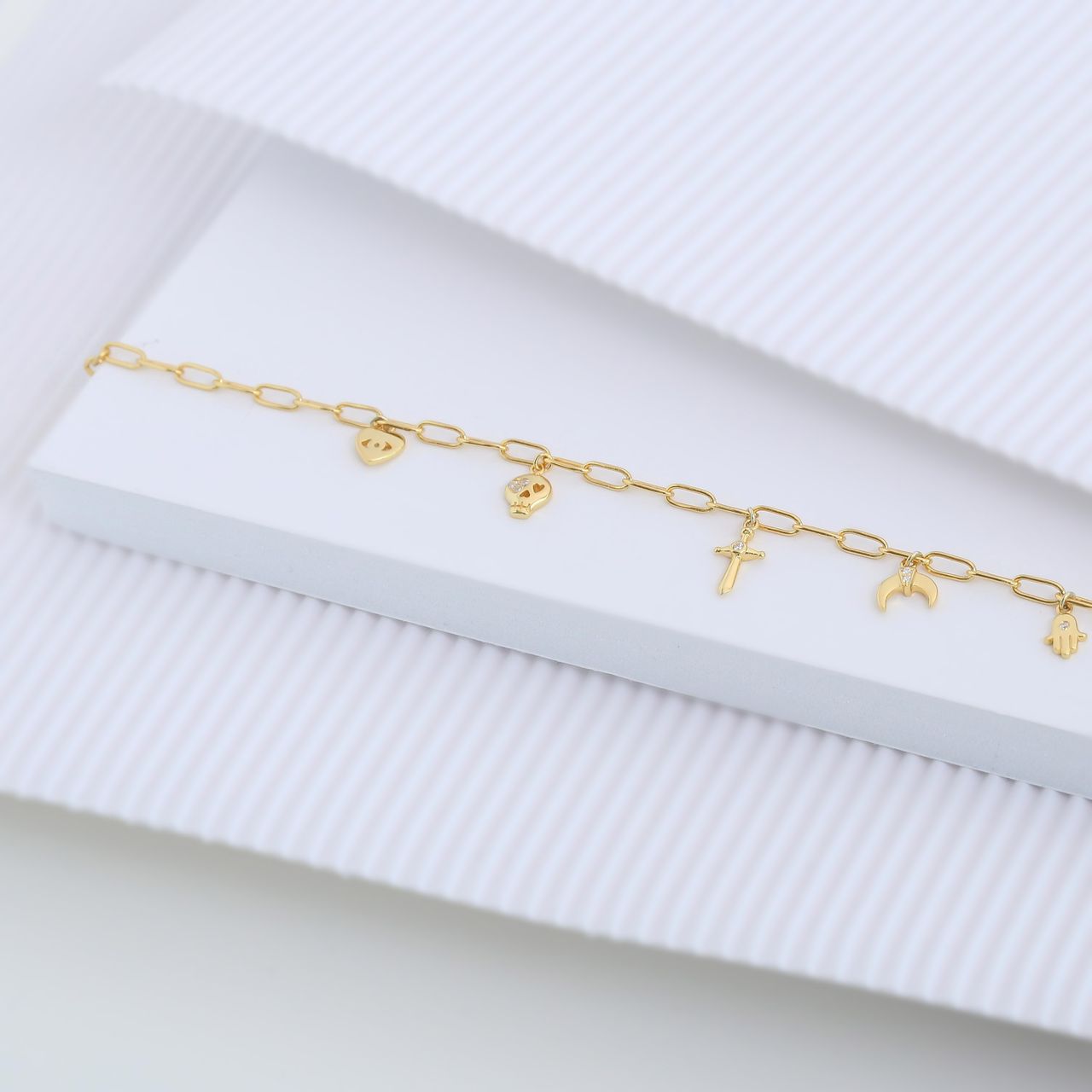 Zilveren goldplated bedelarmband symbols