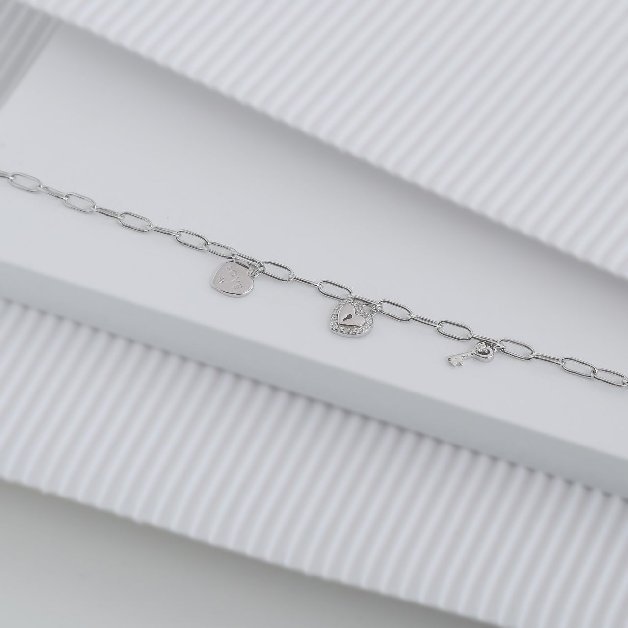 Zilveren bedelarmband key