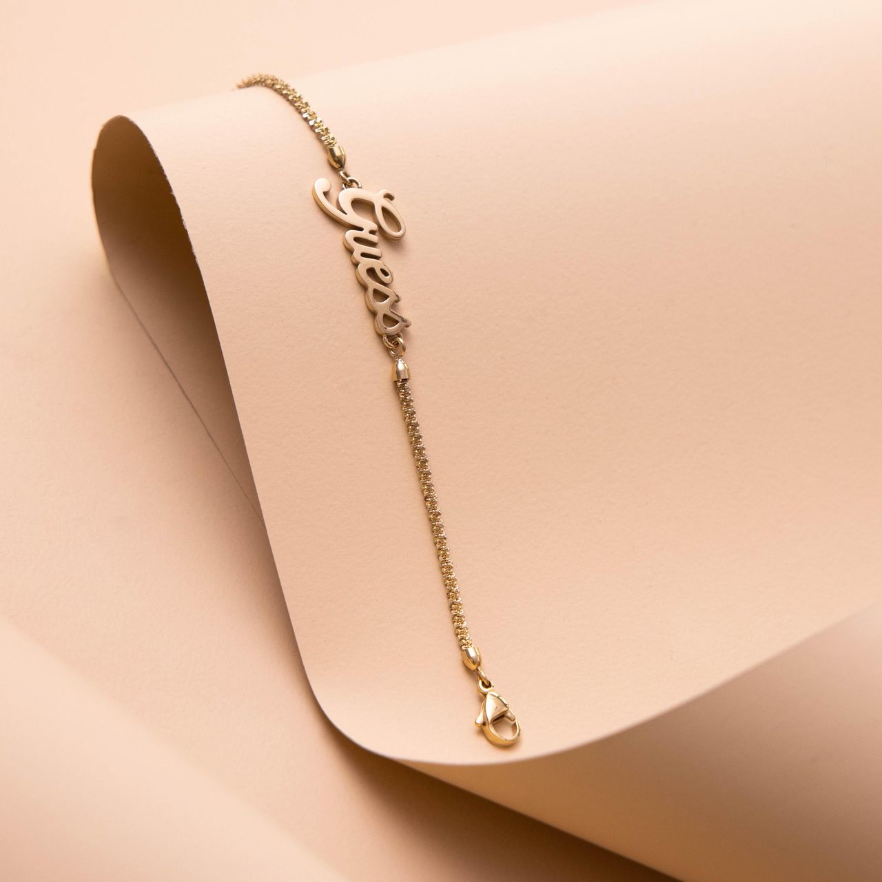Guess stalen goldplated armband Guess LOGO POWER