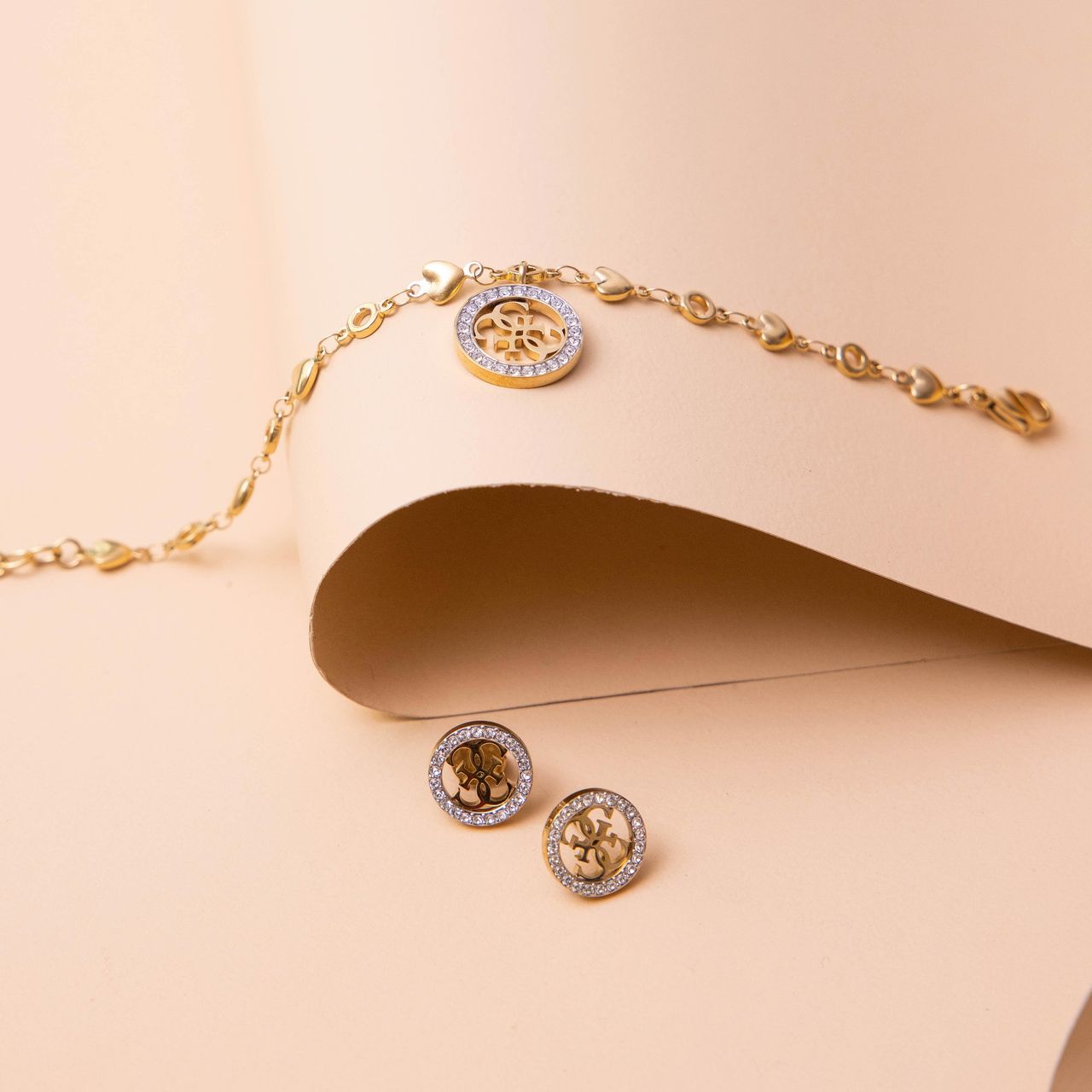 Guess stalen goldplated oorbellen 4G TROPICAL SUN