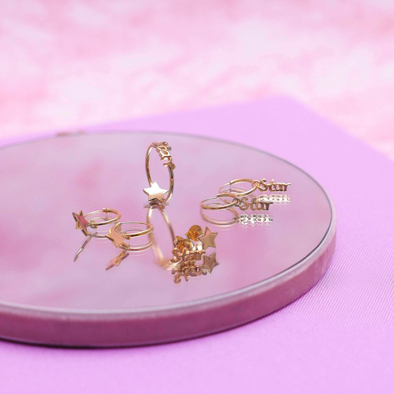 Zilveren goldplated oorknop star