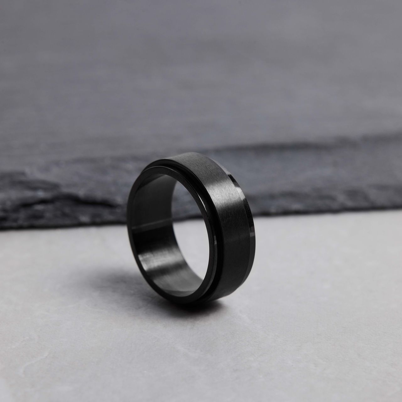 Schwarz beschichteter Anti-Stress-Ring aus Edelstahl