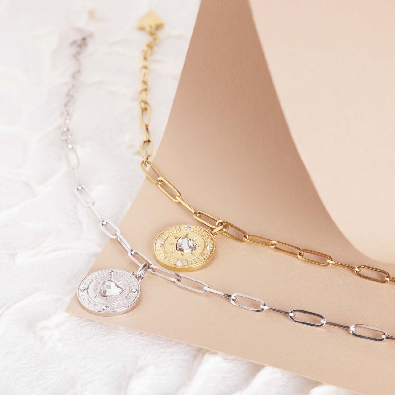 Guess stainless steel goldplated schakelarmband met kristal voor dames