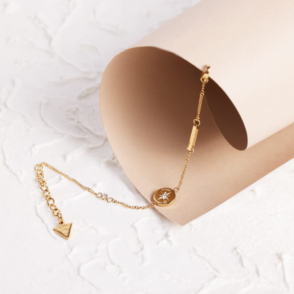 Guess stainless steel goldplated schakelarmband met kristal voor dames