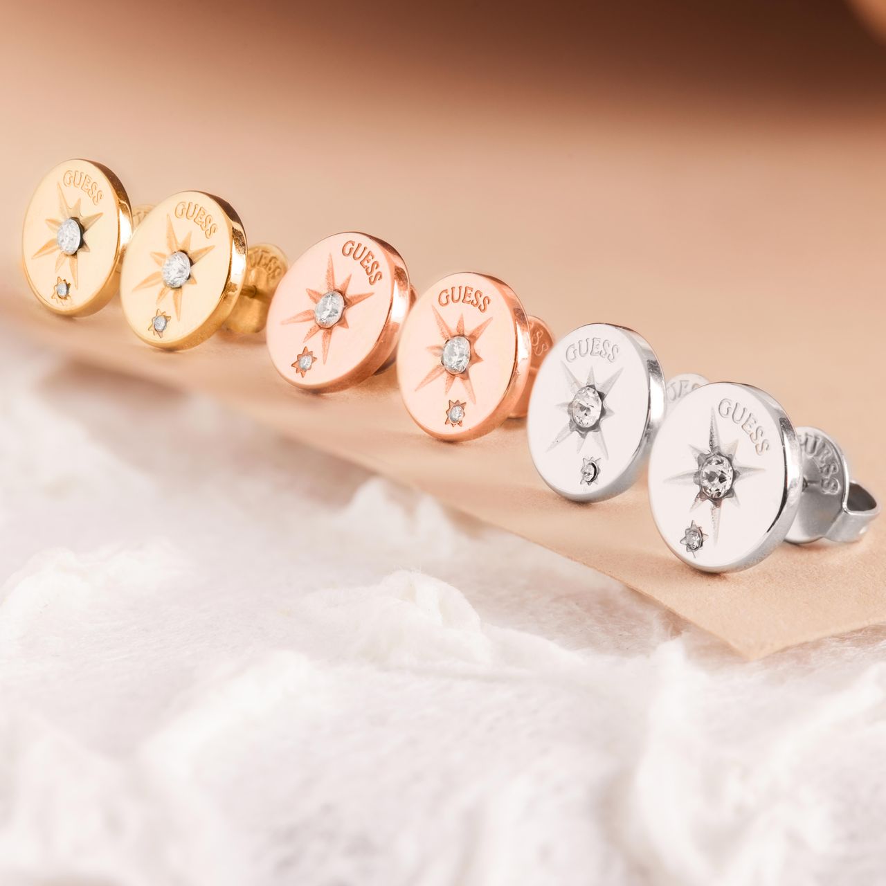 Guess stalen roséplated oorknoppen met kristal voor dames