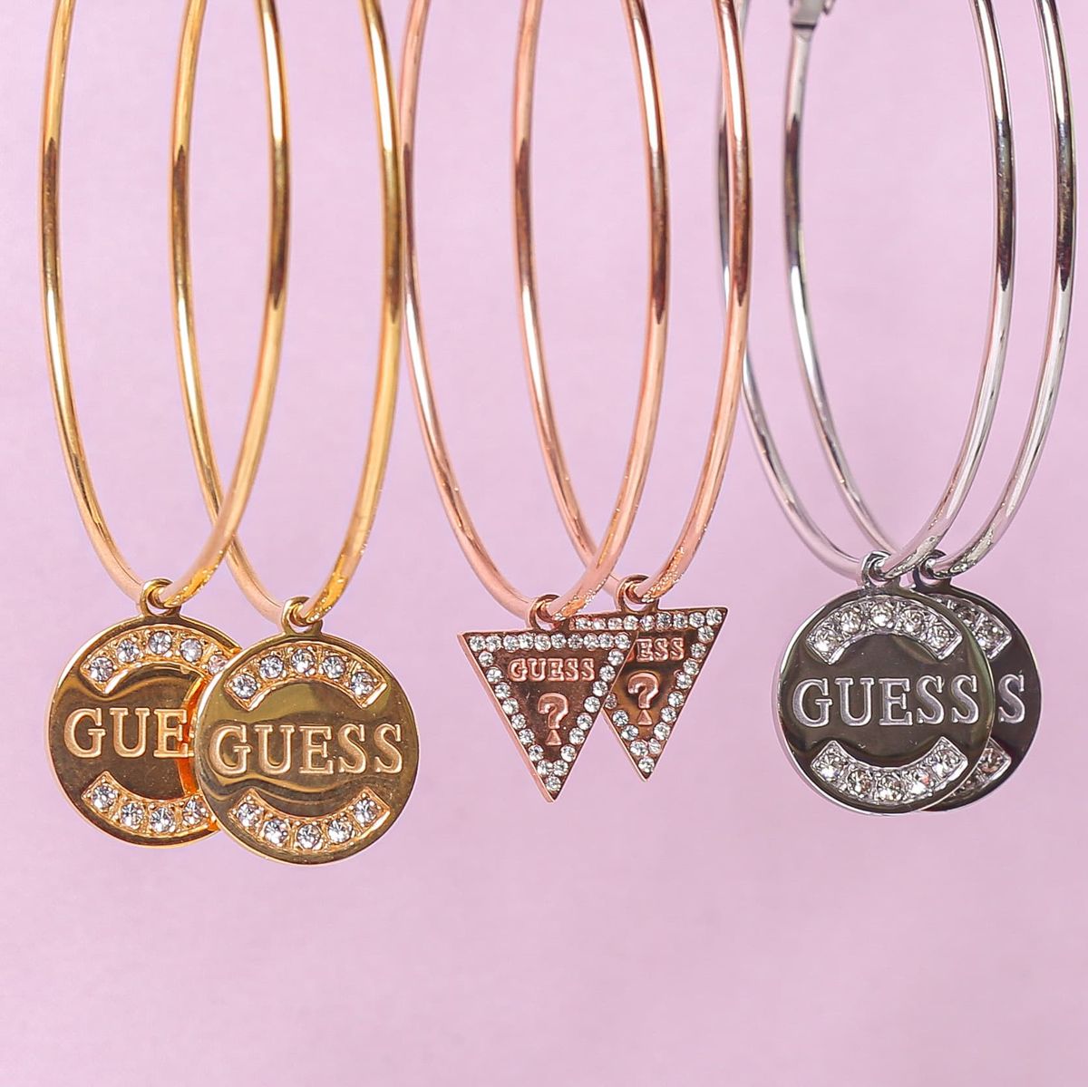 Guess stainless steel roséplated oorringen met hanger triangle met kristal voor dames