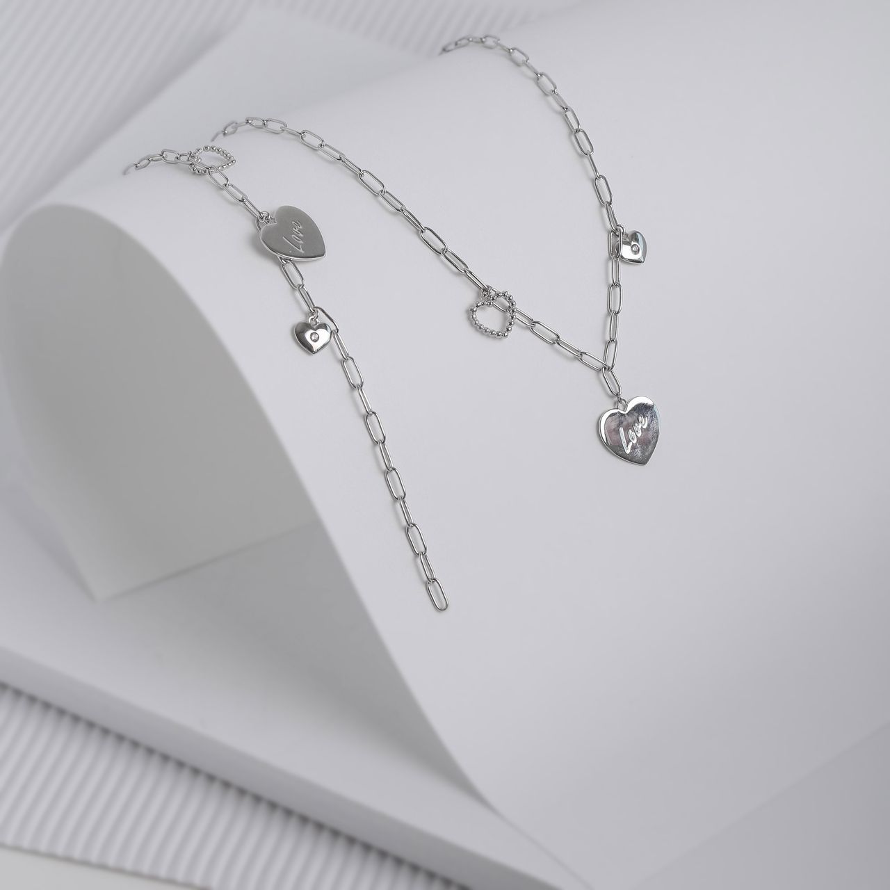 Zilveren bedelarmband harten/love