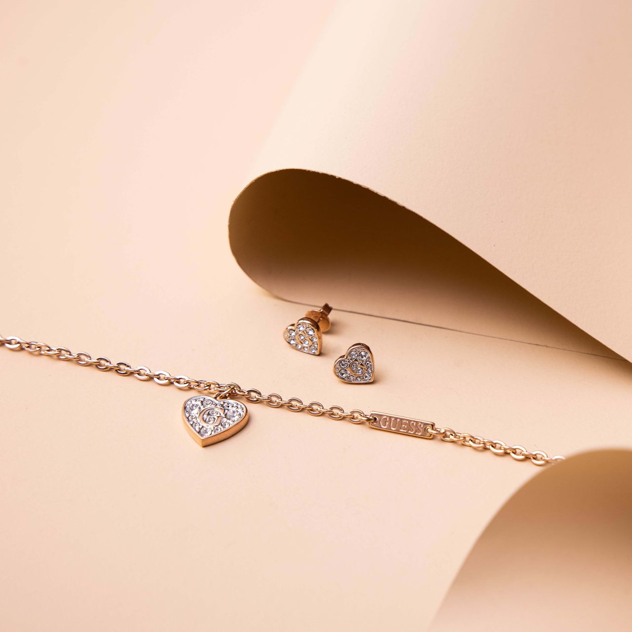 Guess stainless steel roséplated oorknoppen hart met kristal voor dames