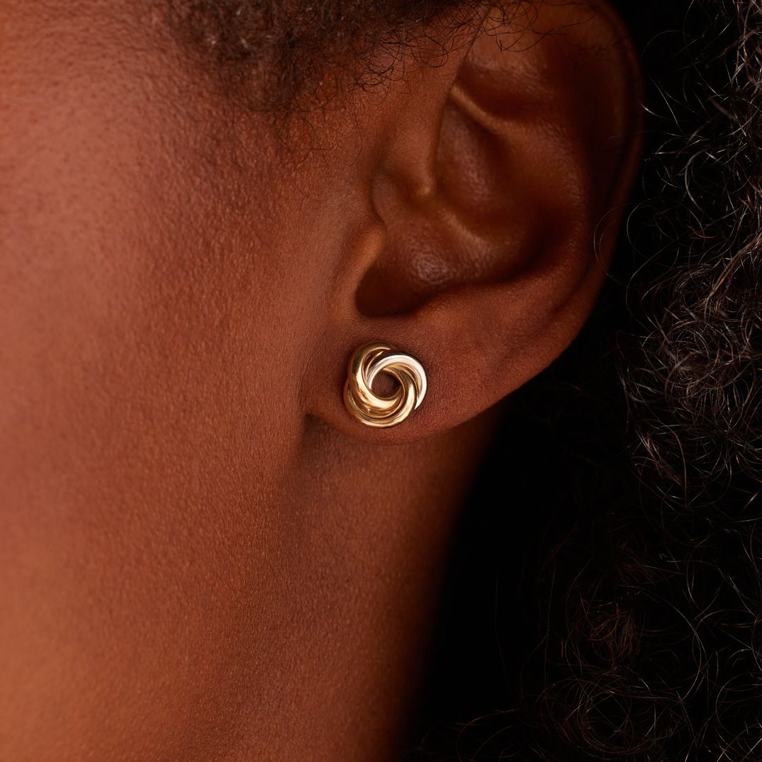 9 karaat oorknoppen swirl bicolor voor dames