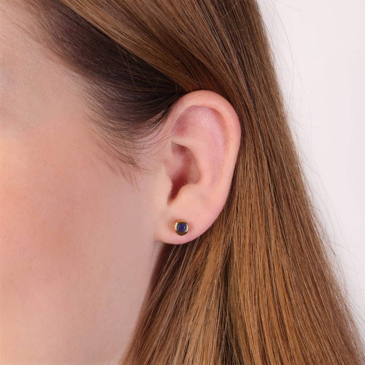 Vergoldete Ohrringe mit blauem Zirkoniastein