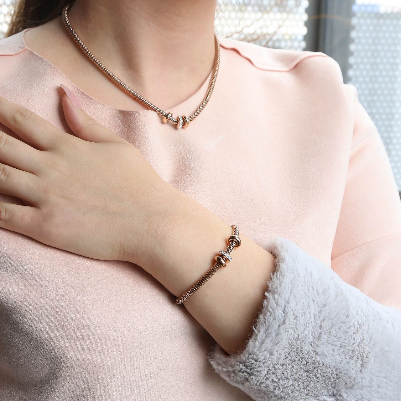 Gerecycleerd stainless steel roseplated ketting&armband 3ringen kristal