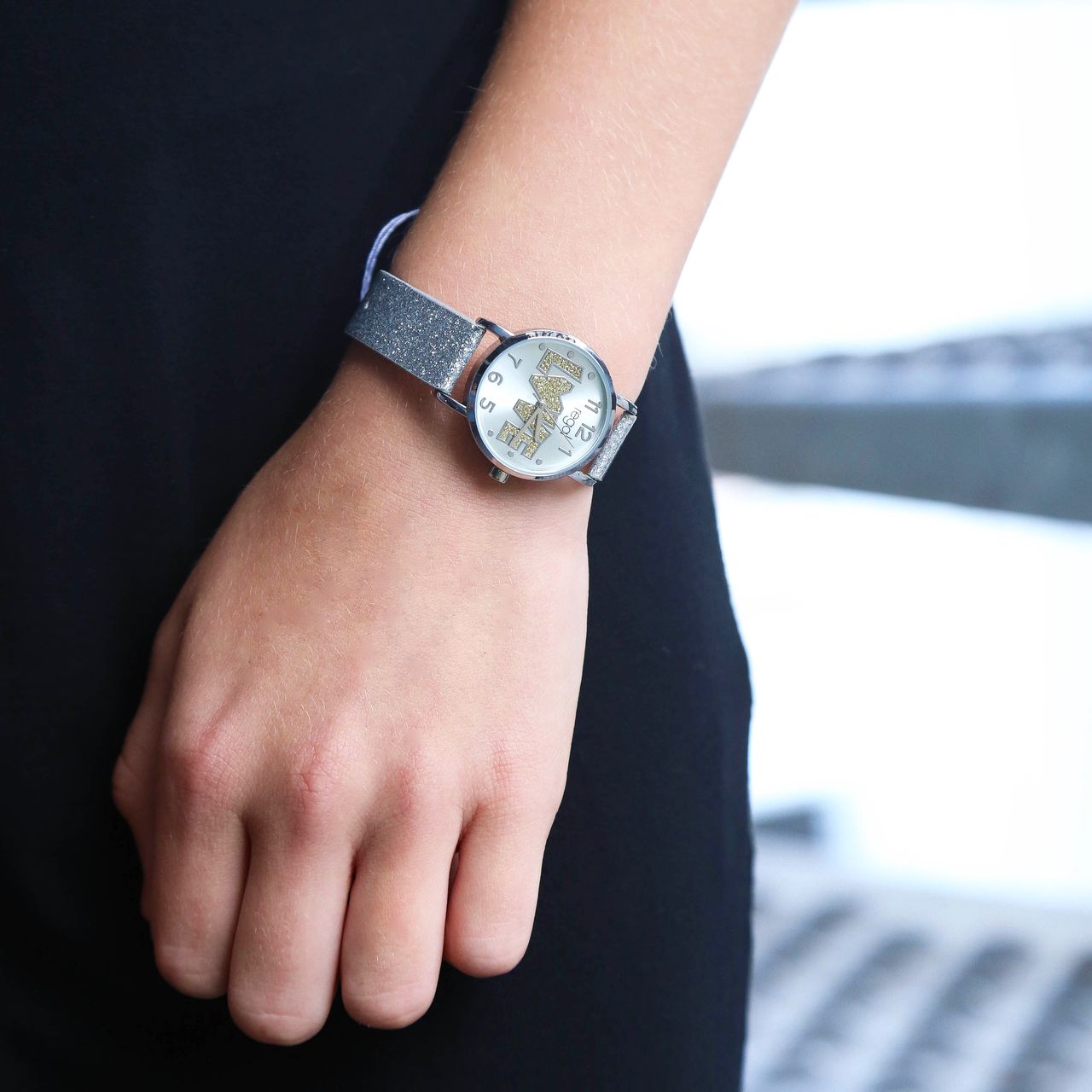 Regal glitter horloge met een zilverkleurige band