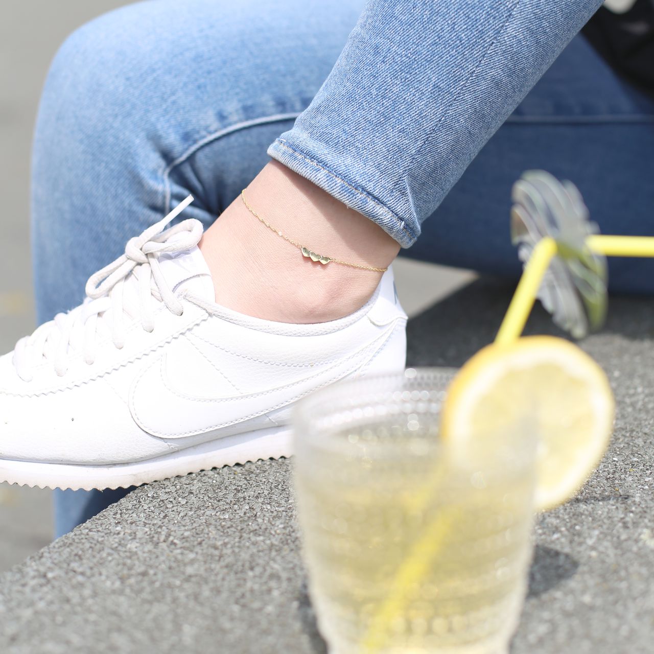 9 Karaat enkelband twist met drie hartjes