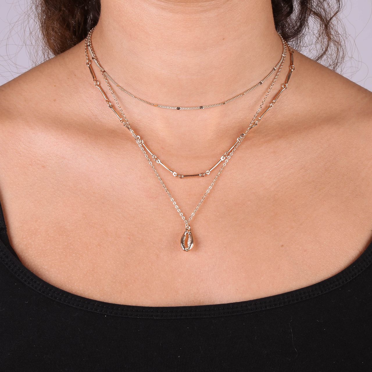 Goudkleurige byoux ketting multi met schelp