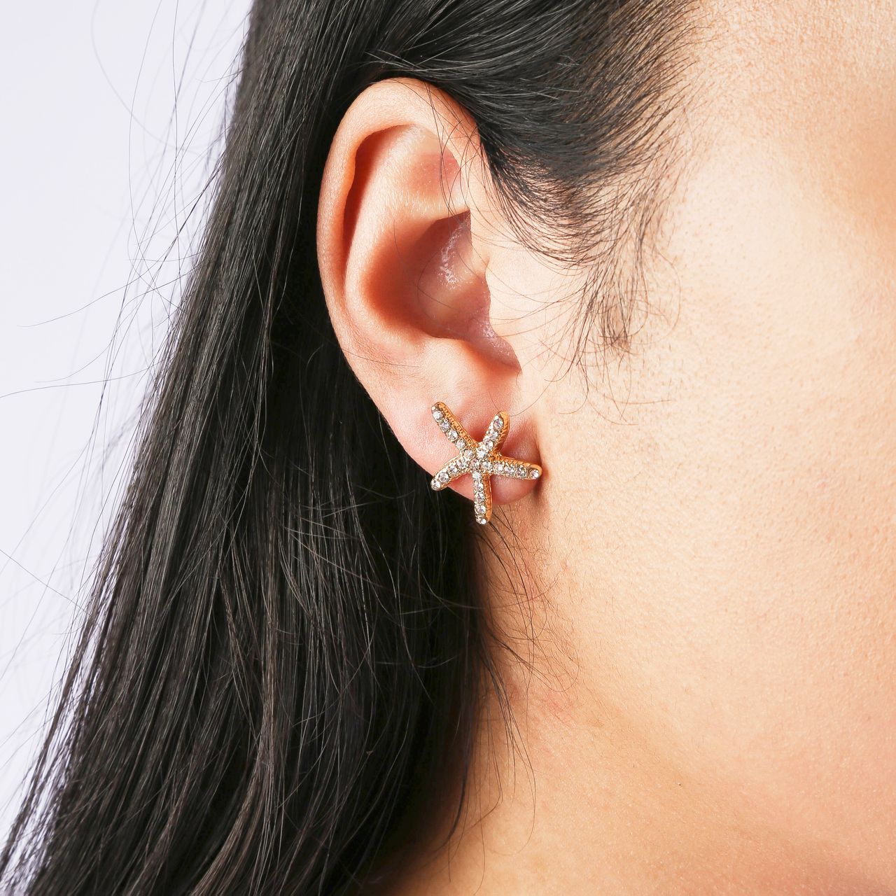 Goudkleurige byoux oorbellen met zeesterren