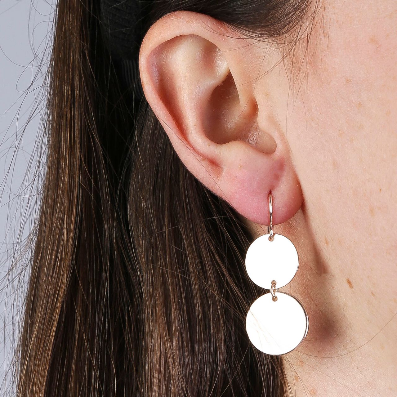 Zilverkleurige byoux oorbellen met muntjes