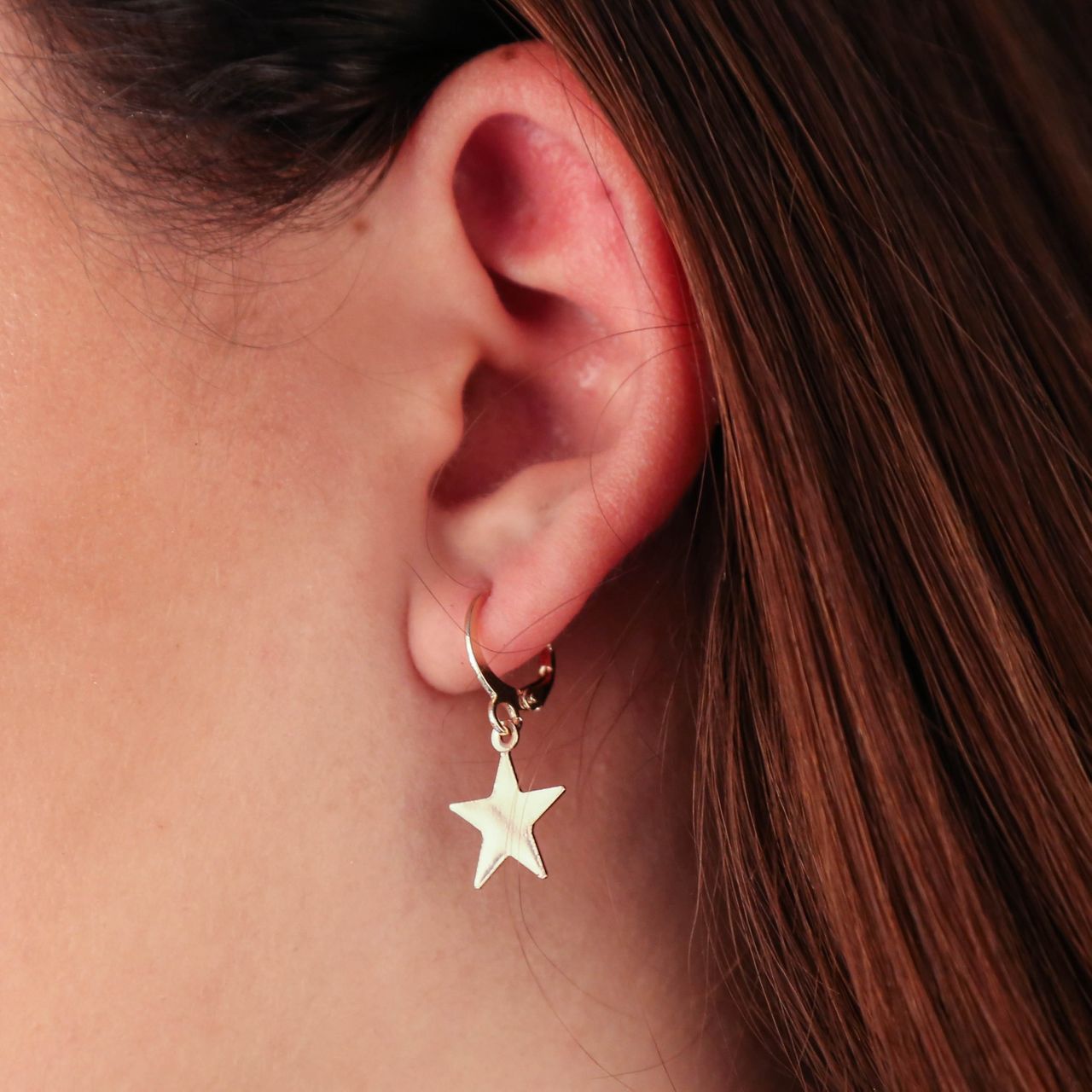Goudkleurige bijoux oorbellen ster