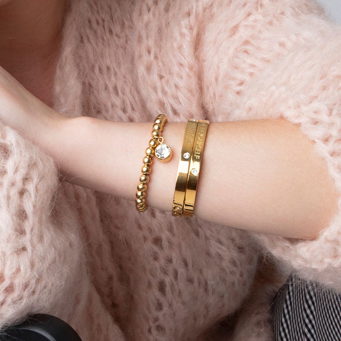 Guess stalen goldplated kralenarmband met hanger met kristal voor dames