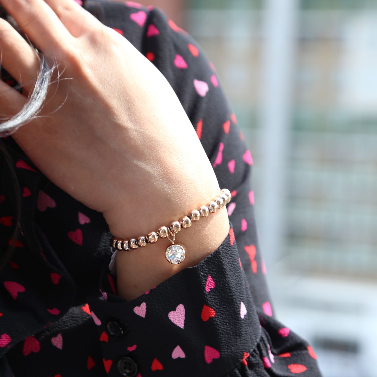 Guess stalen roséplated kralenarmband met hanger met kristal voor dames