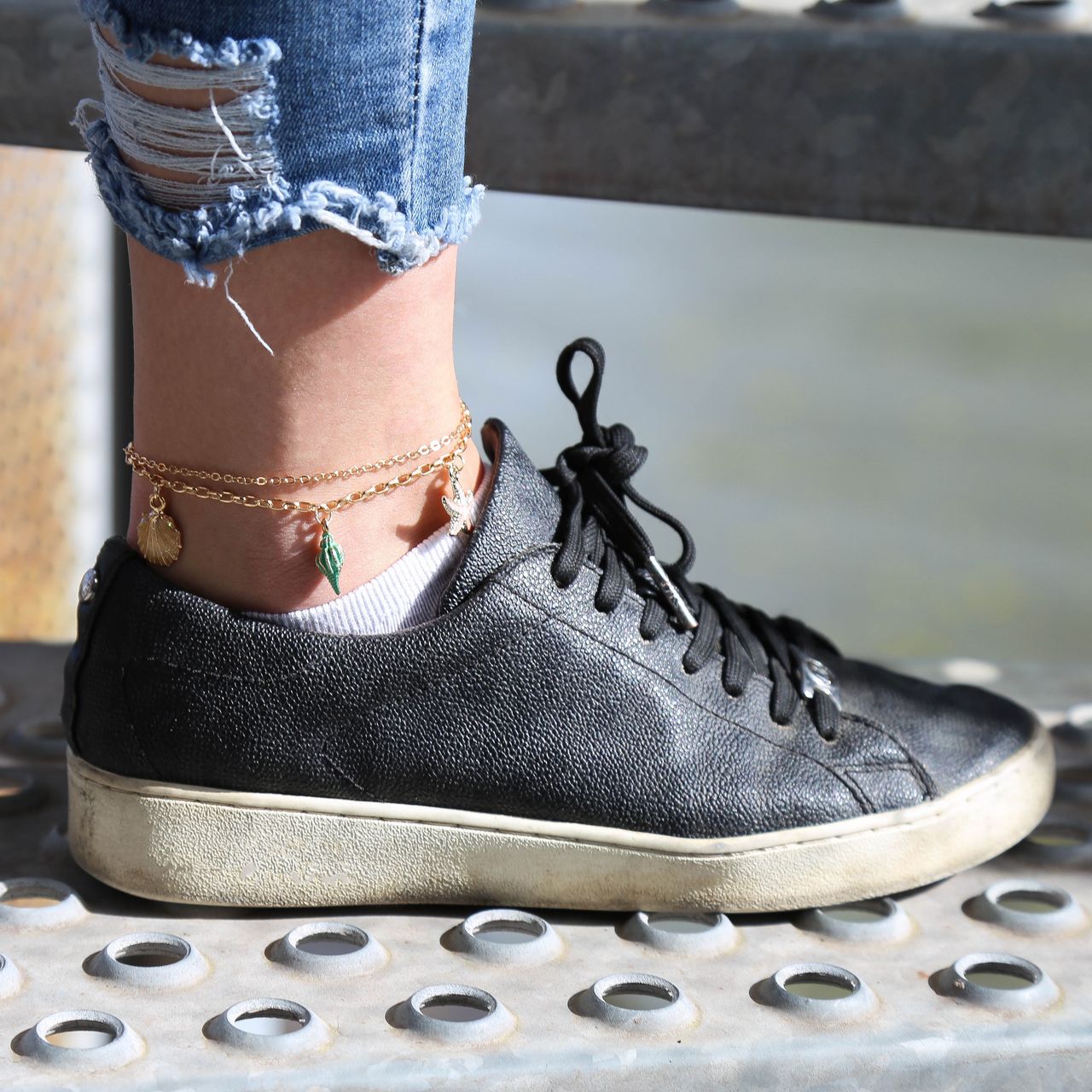 Goudkleurig byoux enkelbandje bedels