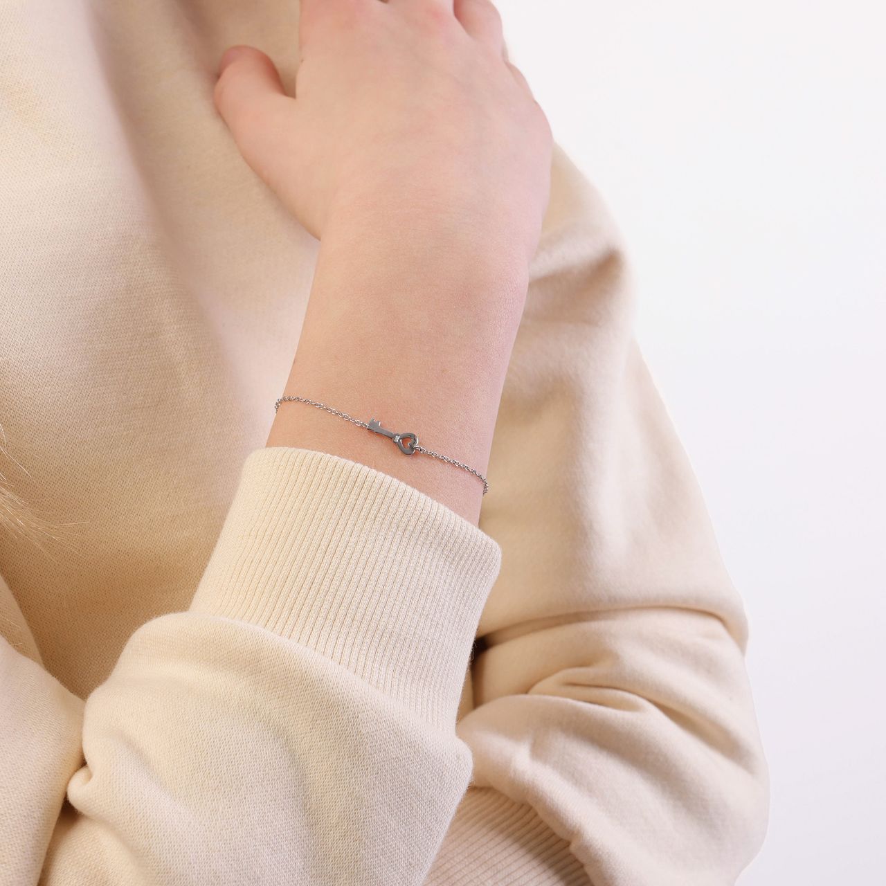 Zilveren armband sleutel/hart