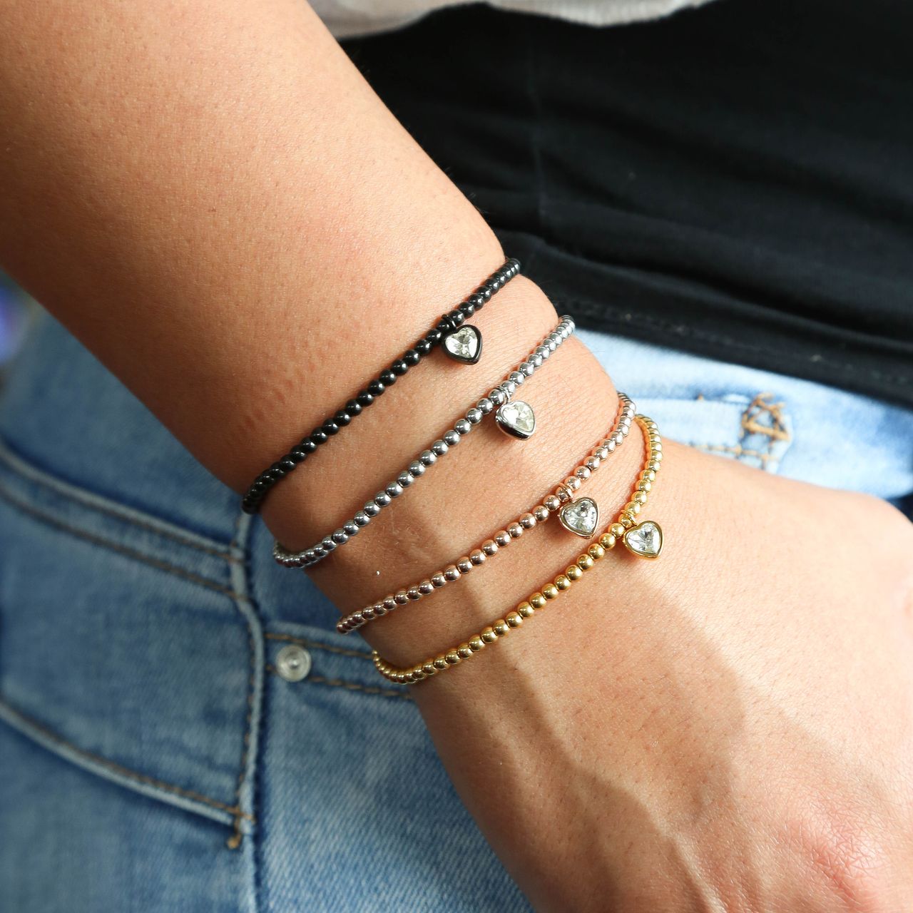 Gerecycleerd stainless steel armband gold bol/hart wit kristal