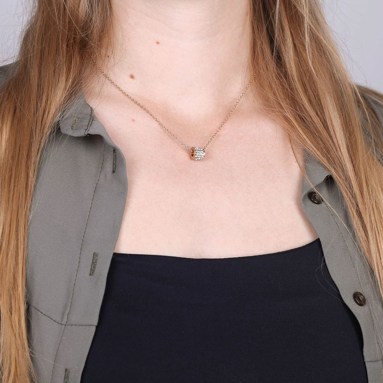 Goudkleurige bijoux ketting in een Kerstbal