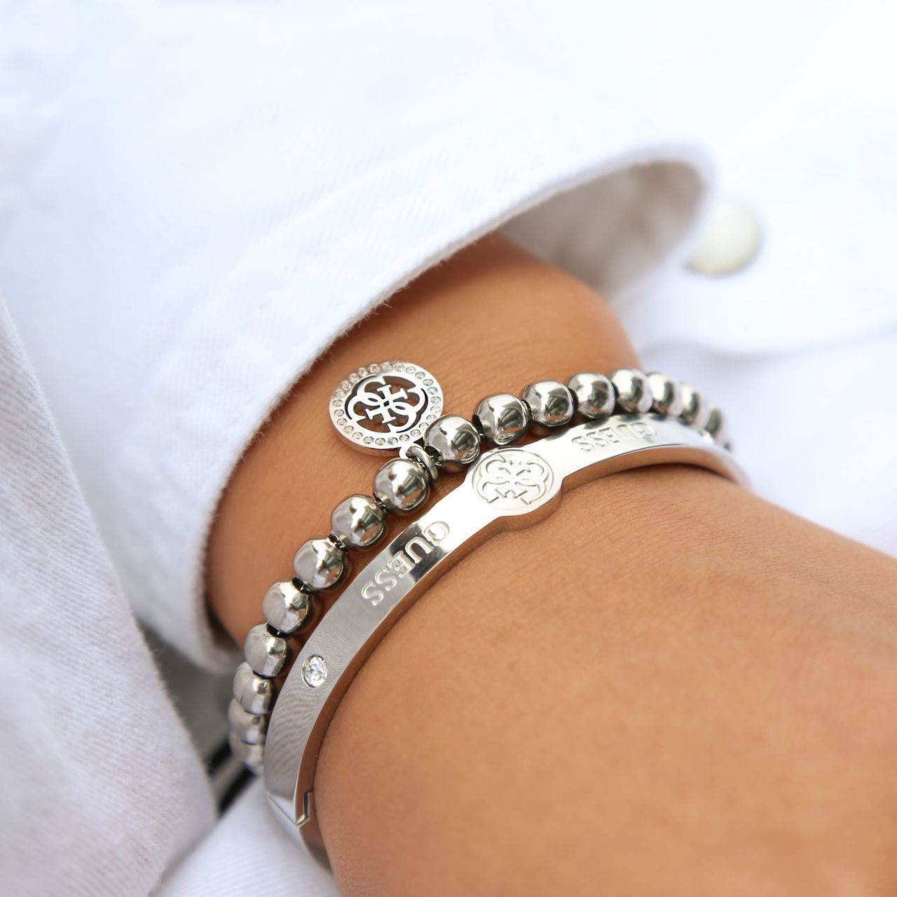 Guess stainless steel koord armband 4G logo