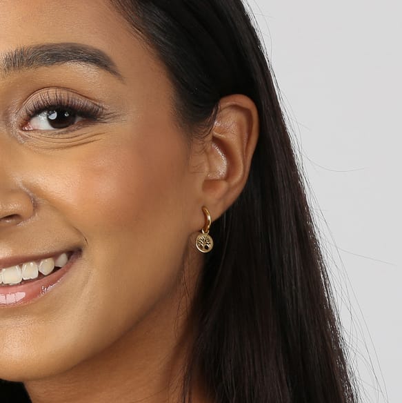 Stalen oorringen goldplated met hanger levensboom