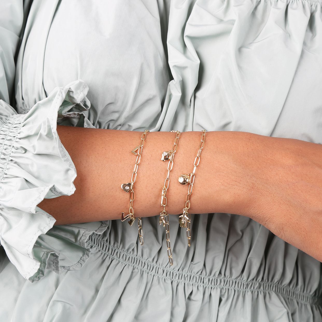 Zilveren goldplated bedelarmband symbols