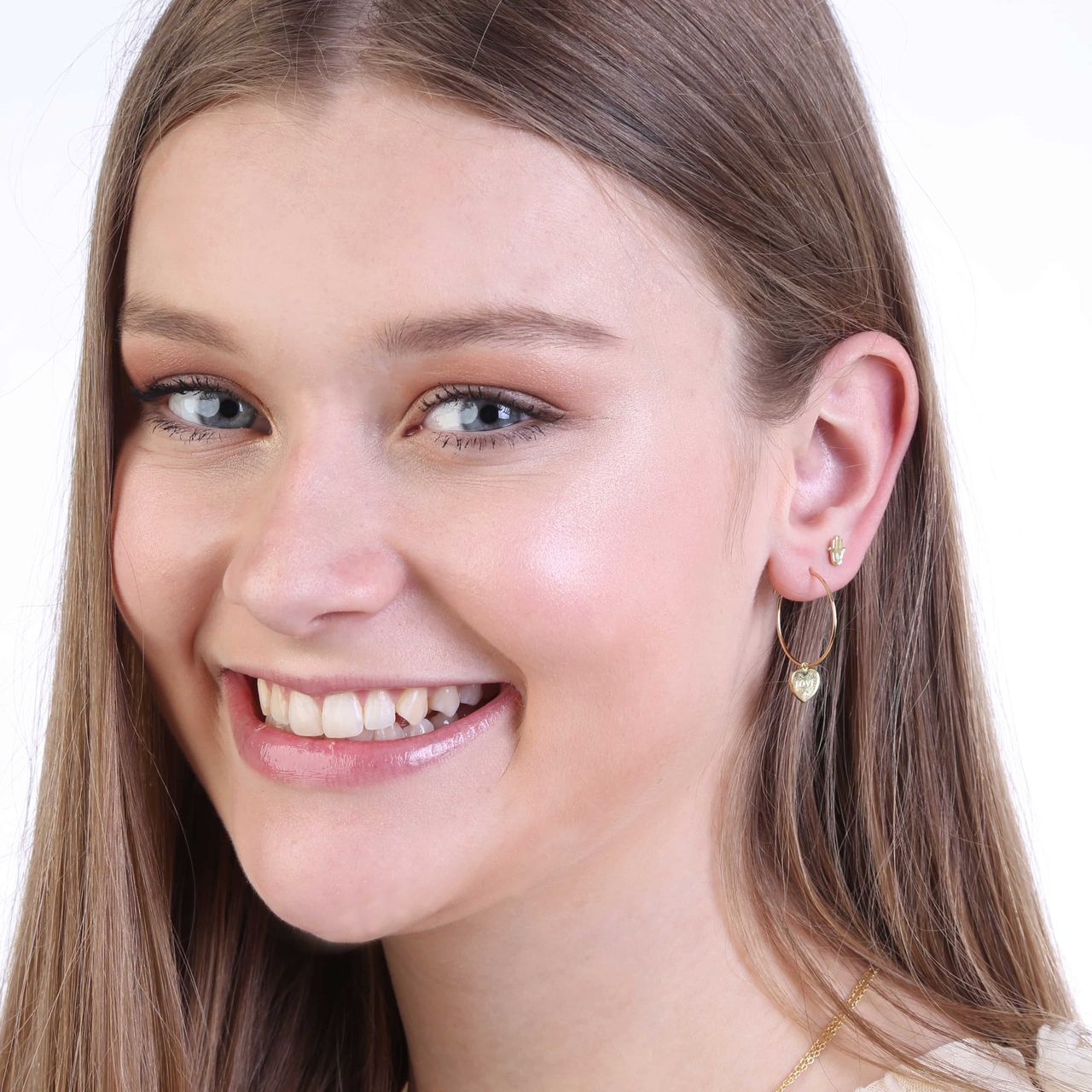 Zilveren goldplated oorknop Hamsa