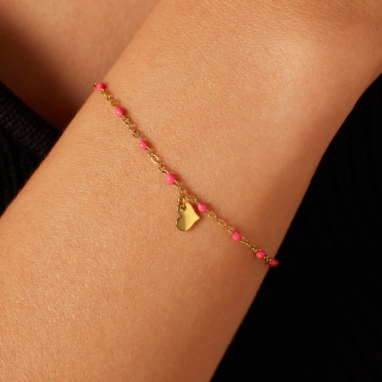 Stainless steel goldplated kralenarmband hart fuchsia emaille voor dames