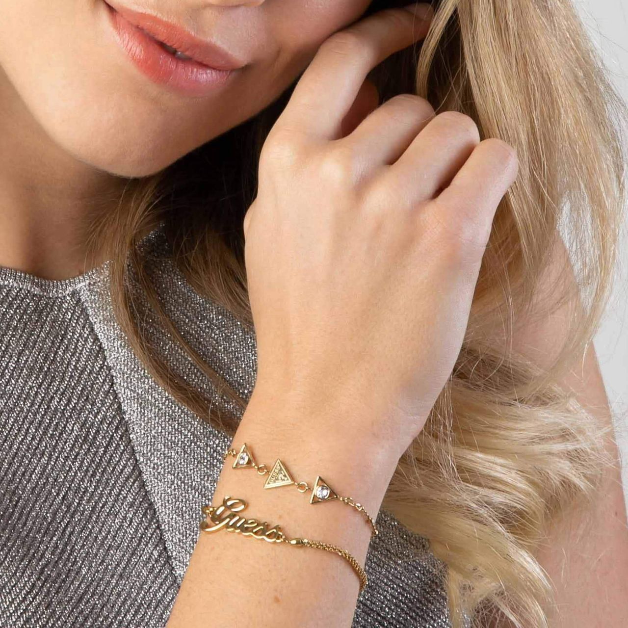 Guess stainless steel goldplated fantasiearmband met hanger met kristal voor dames