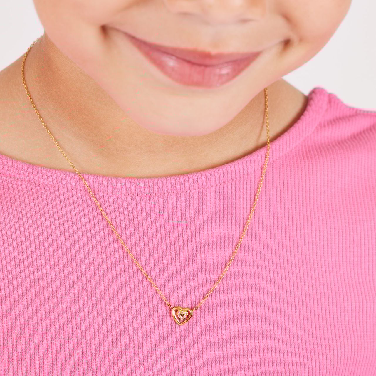 Zilveren goldplated kinderoorknoppen hart met zirkonia