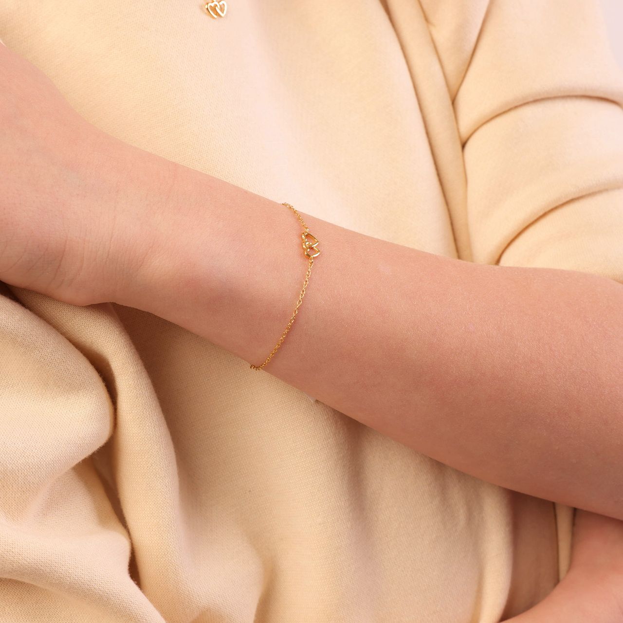 Zilveren goldplated kinderarmband dubbel hart