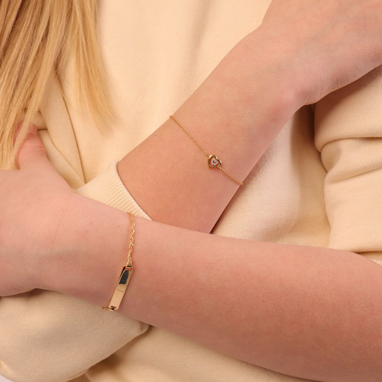 Zilveren goldplated kinderarmband met hart en zirkonia