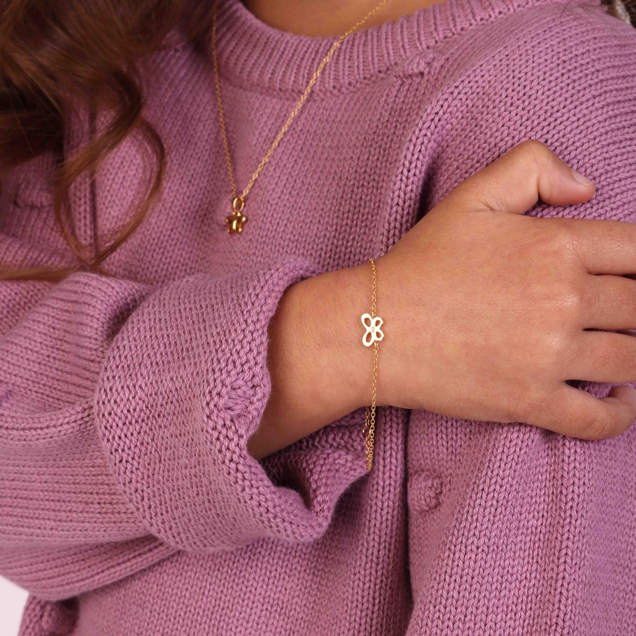 Zilveren goldplated kinderarmband met vlinder