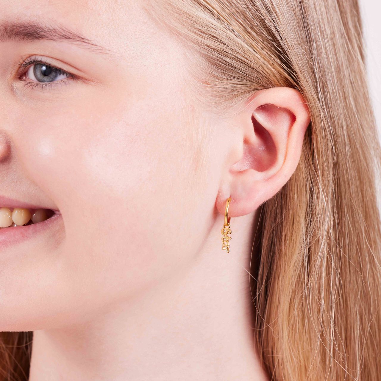 Zilveren goldplated oorringen met hanger star