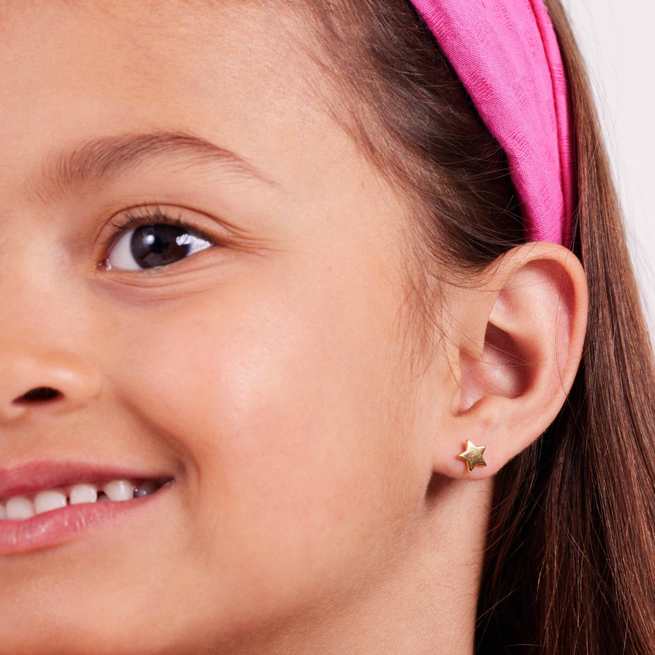 Zilveren goldplated oorknop star