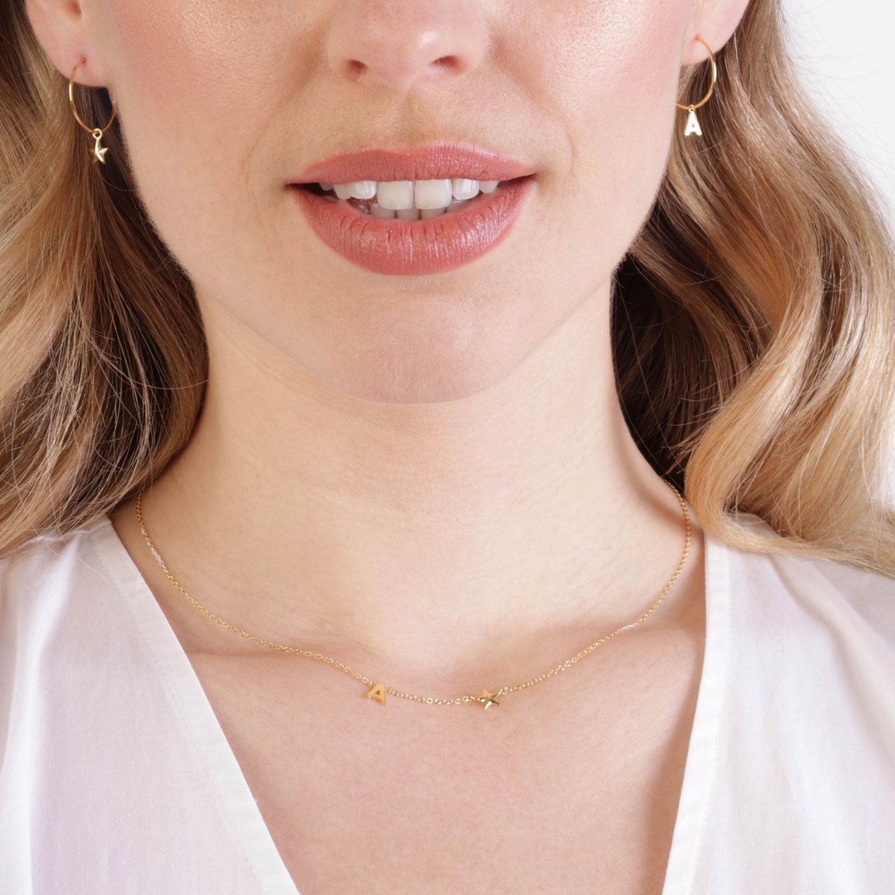 Zilveren goldplated ketting met letterhanger en ster voor dames