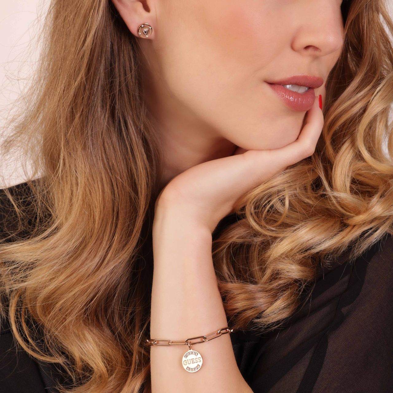 Guess stainless steel roséplated schakelarmband met hanger met kristal voor dames