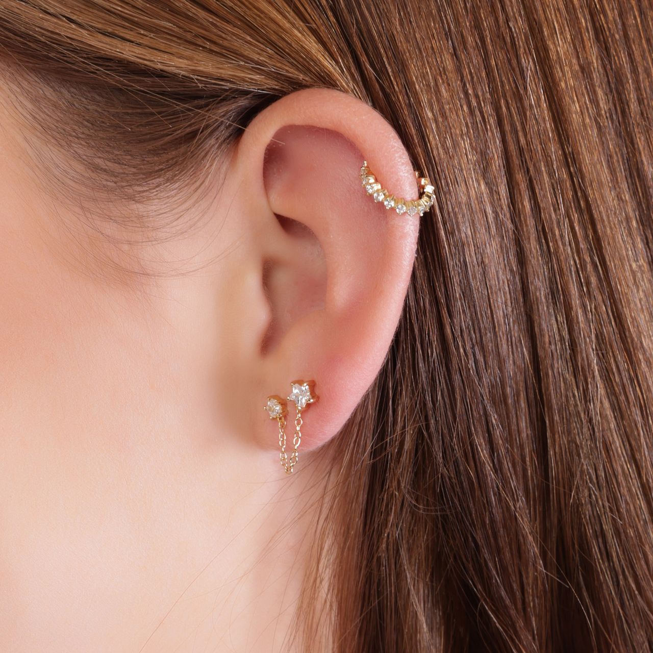 Zilveren goldplated oorknop dubbel ster zirkonia