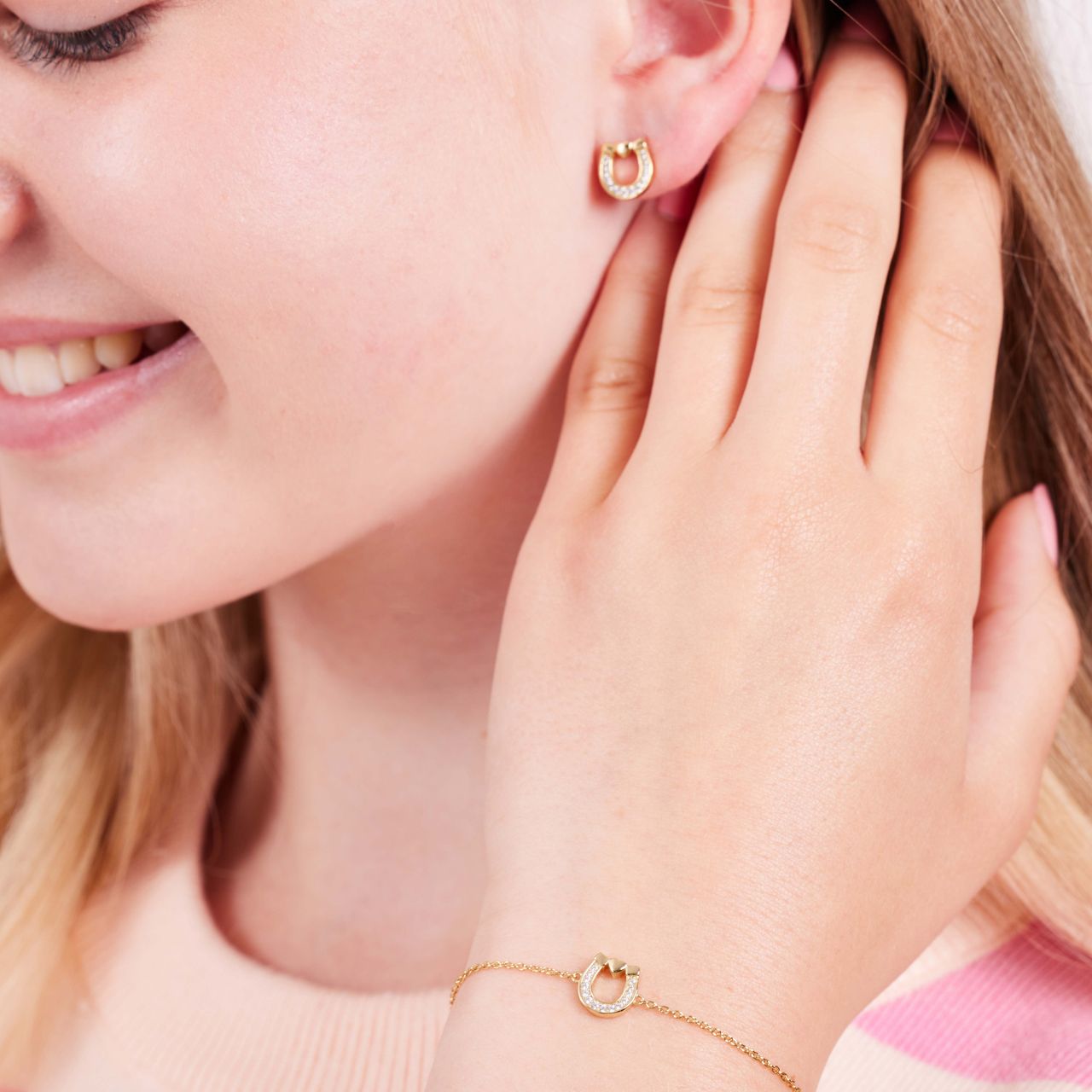 Zilveren goldplated kinderarmband met hoefijzer en zirkonia