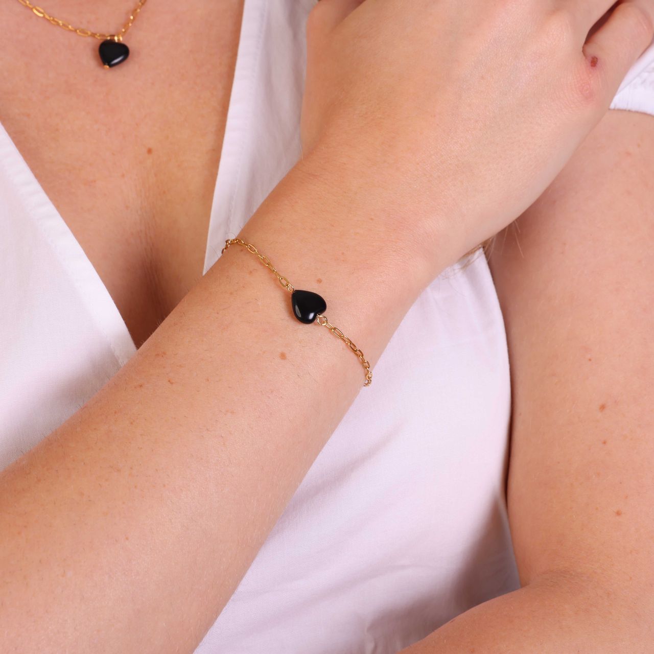 Stainless steel goldplated fantasiearmband met hanger hart met obsidiaan voor dames