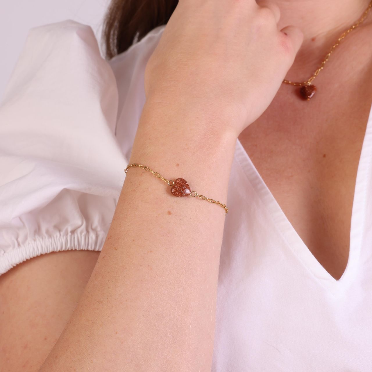 Stainless steel goldplated fantasiearmband met hanger hart met zonnesteenvoor dames